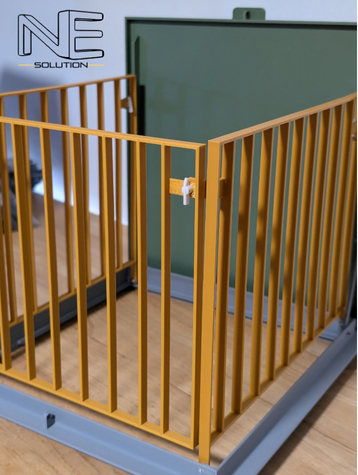 3D printed scale model of a construction safety system, showing a yellow gate and green access hatch.