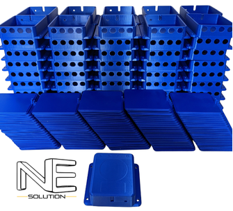 A low-volume manufacturing batch of blue 3D printed electrical enclosures and lids, stacked on a workbench.